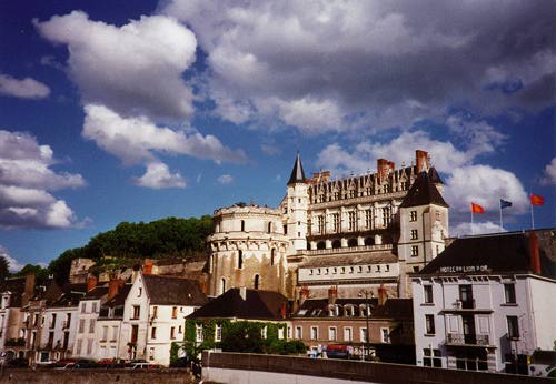 Big fancy chateau on a hill with some impressive clouds overhead