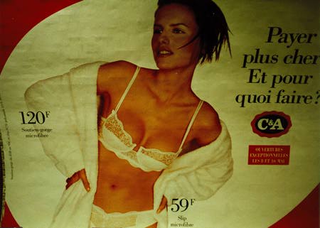 Billboard with an attractive woman in bra, panties, and
bathrobe