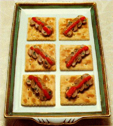 Mushrooms and pimentos on saltine crackers